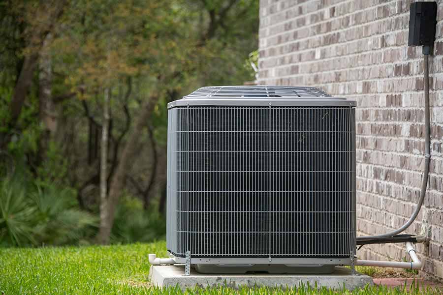 AC installation unit beside home wall in Oxford MS