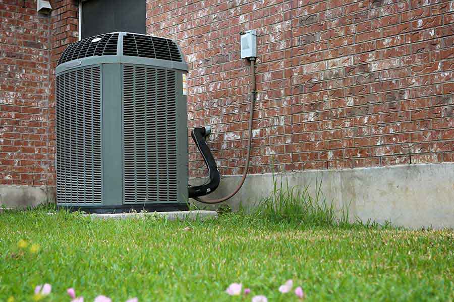 Heat pump installation beside brick home exterior unit in Oxford MS