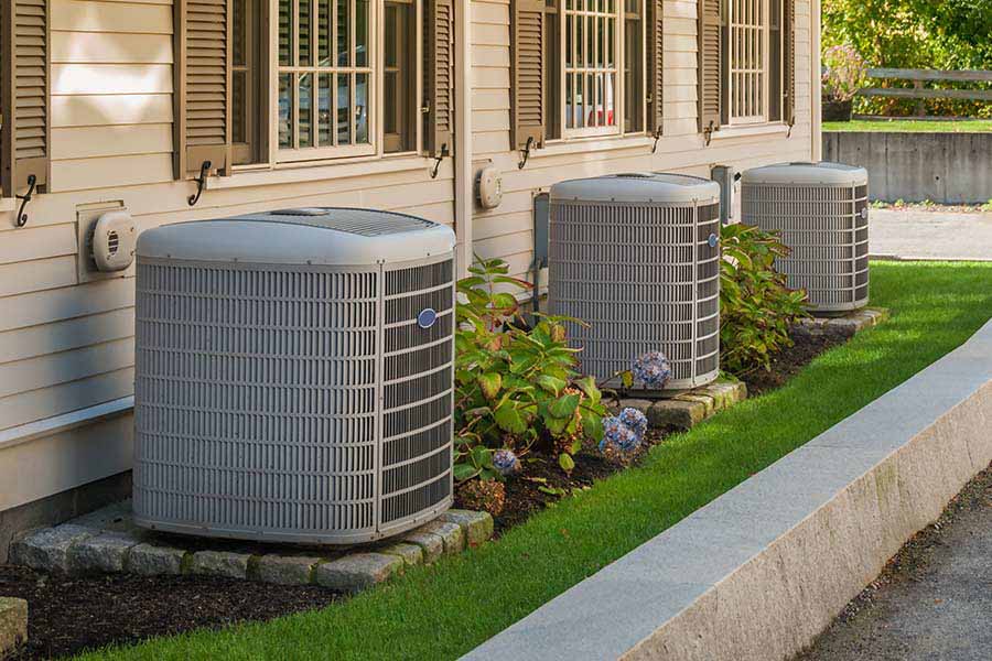 Multiple outdoor AC units installed beside residential home in Oxford MS